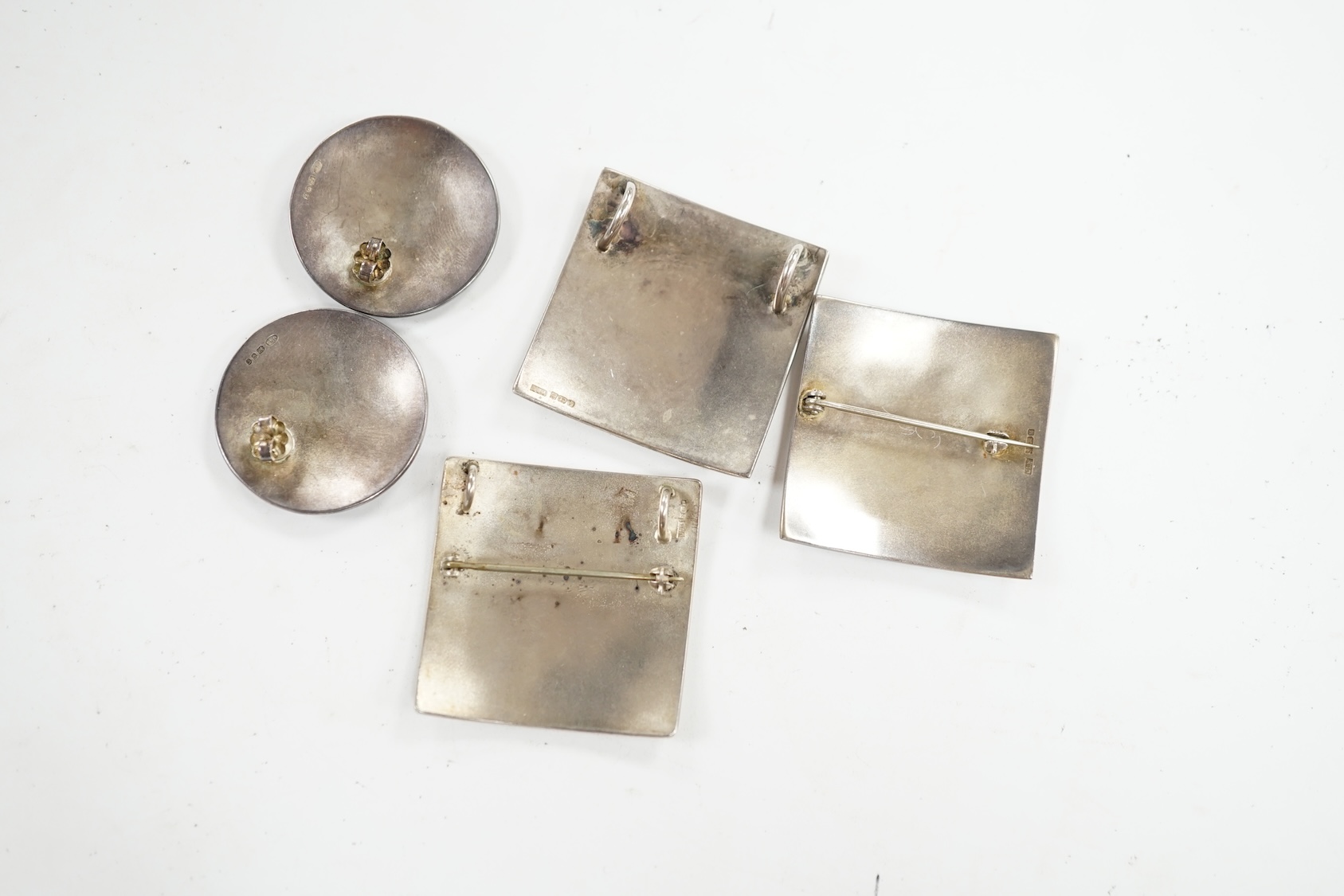 Two modern Jane Moore silver and enamel square brooches, 35mm and a similar Jane Moore pendant, together with a pair of similar earrings, maker JLB. Condition - fair